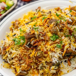 Mutton biryani with yogurt salad