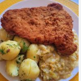 Klasyka Polaka- Schabowy z ziemniakami i zasmażaną kapustą kiszoną.