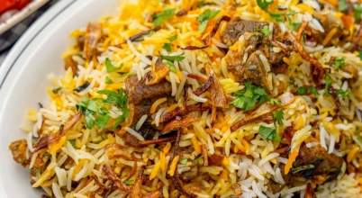 Mutton biryani with yogurt salad